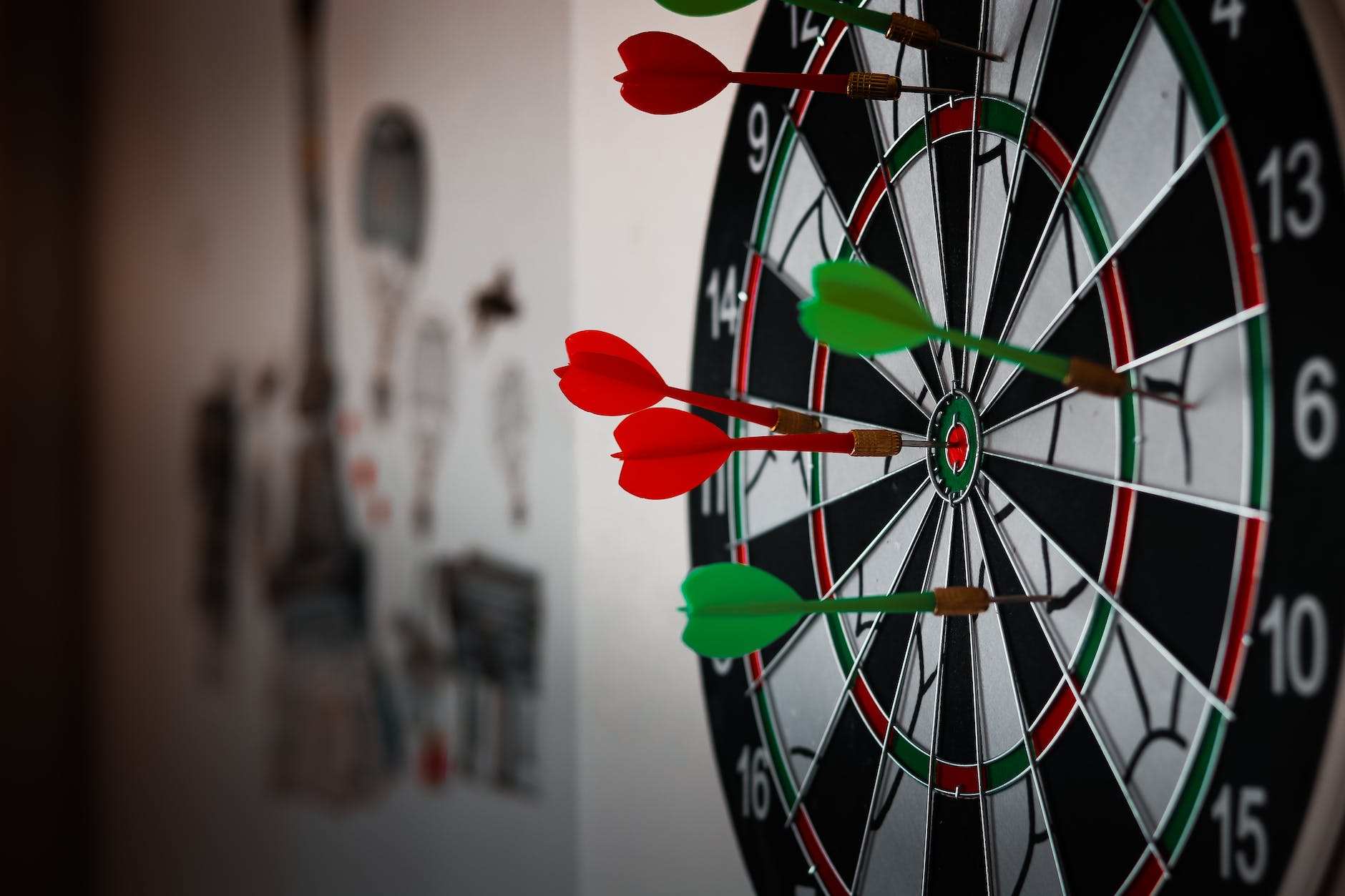 close up photo of dart pins on dartboard